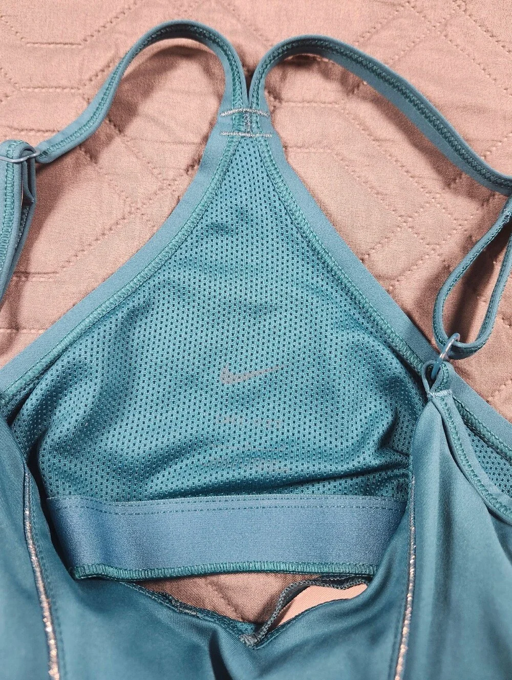 teal Nike Dri-FIT Indy light-support sports bra sparkling metallic tape accents